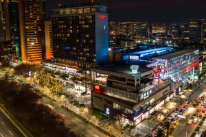 a view of a city at night with traffic at Courtyard by Marriott Santiago Las Condes in Santiago