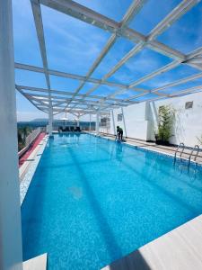 a large swimming pool on top of a building at Aesthetic One Bedroom Beside SM w Pool, Wifi and Netflix in Cagayan de Oro