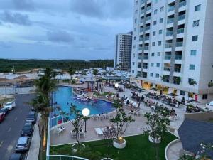 a view of a resort with a pool and buildings at Salinas Park Resort in Salinópolis
