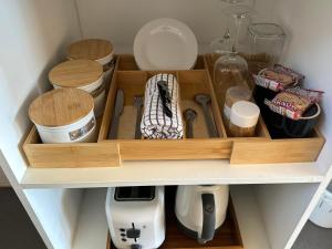 a drawer filled with wooden utensils in a kitchen at Sunflower Motel in Warialda