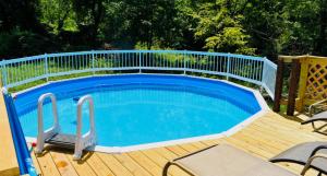 a pool on a deck with a fence around it at 1 Sweet Retreat in Nashville