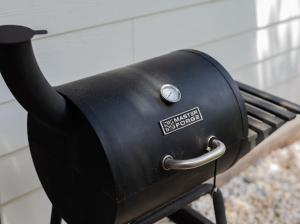 a black grill with a sticker on the side of it at Luxury cottage in San Antonio