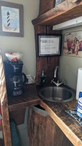 a kitchen with a sink and a coffee maker at SeaWatch Bed & Breakfast in Halifax