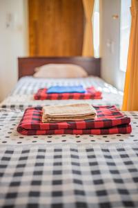 Postel nebo postele na pokoji v ubytování Skybird Homestay