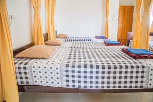 Postel nebo postele na pokoji v ubytování Skybird Homestay
