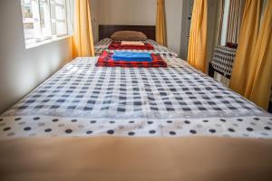 Postel nebo postele na pokoji v ubytování Skybird Homestay