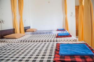 Postel nebo postele na pokoji v ubytování Skybird Homestay
