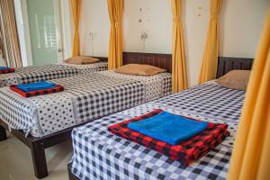 Postel nebo postele na pokoji v ubytování Skybird Homestay