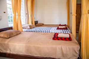 Postel nebo postele na pokoji v ubytování Skybird Homestay