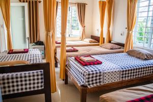 Postel nebo postele na pokoji v ubytování Skybird Homestay
