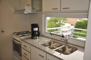 Kuchyň nebo kuchyňský kout v ubytování Livin' Residence Rosario + 12 fotografií