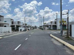 an empty street in a town with houses at ASFA Guesthouse in Alor Setar +6 photos
