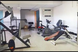 a gym with several exercise bikes in a room at Feeling Tip’Sea in San Juan
