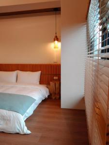 Voodi või voodid majutusasutuse Jiaoxi Pusu Homestay toas