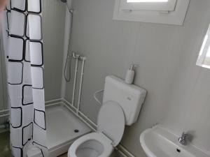 a small bathroom with a toilet and a sink at Domino in Hluboká nad Vltavou