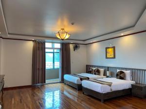 Кровать или кровати в номере citybay homestay ha long 3BR