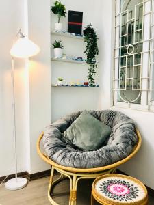 a circular chair with a pillow in a room at Mika Homestay Simple & Cozy in Hanoi