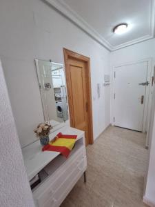 a bathroom with a sink and a mirror on a counter at Vista al Mar with Parking Space in La Mata +11 photos