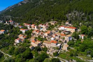 an aerial view of a village on a mountain at Stone House Biskup in Babino Polje