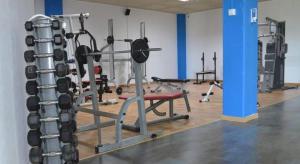 a gym with lots of equipment in a room at Villa Valentina in Estepona