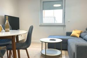 a living room with a couch and a table at At Jenny in Omiš
