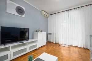 TV a/nebo společenská místnost v ubytování Dea B4+1