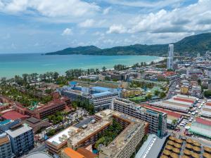 an aerial view of a city and the ocean at Patong Poshtel in Patong Beach