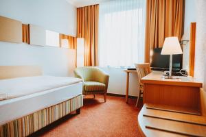 Posteľ alebo postele v izbe v ubytovaní Hotel Brücklwirt