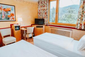 Posteľ alebo postele v izbe v ubytovaní Hotel Brücklwirt