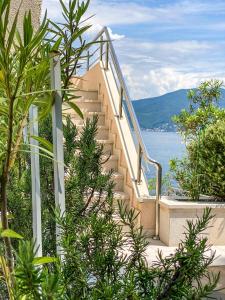 a set of stairs with a view of the water at Leut Apartments in Tivat