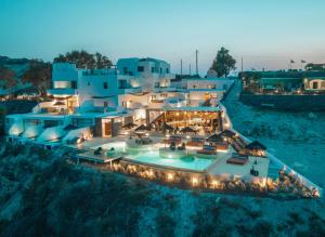 an aerial view of a house with lights at Divino Caldera in Akrotiri