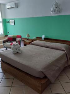 Postel nebo postele na pokoji v ubytování B&B Albachiara