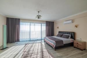 Postel nebo postele na pokoji v ubytování Beyza Villa