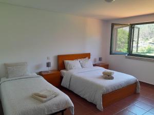 Ένα ή περισσότερα κρεβάτια σε δωμάτιο στο CabrilHome - AL Gerês