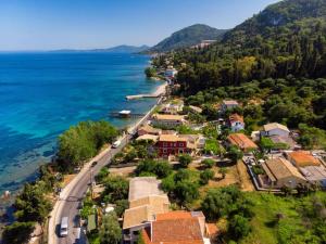 an aerial view of a small town next to the ocean at Achilleion Holiday Home in Achílleion