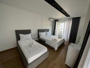 Katil atau katil-katil dalam bilik di Suite Hotel
