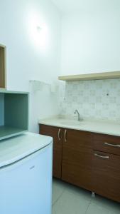 a kitchen with a sink and a counter top at Huzur Pansiyon ve Cay Bahcesi in Bursa