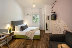 Postel nebo postele na pokoji v ubytování Travel Hotel Eilon