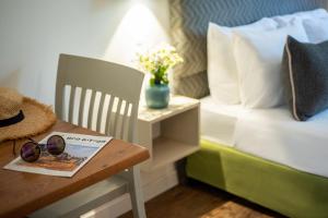 Postel nebo postele na pokoji v ubytování Travel Hotel Eilon