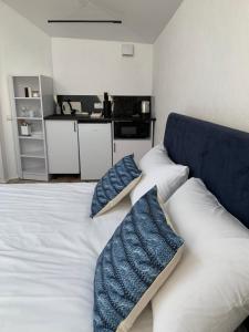 a bedroom with a bed with two pillows on it at Center Lviv Avenue 23 in Lviv