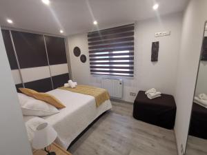 Łóżko lub łóżka w pokoju w obiekcie A CASA DO LADO
