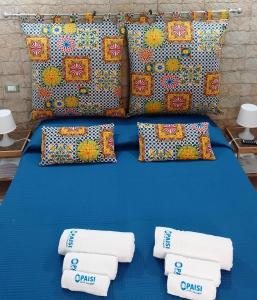 Ένα ή περισσότερα κρεβάτια σε δωμάτιο στο O'Paisi Casa Vacanze