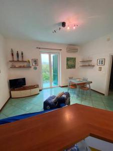 a living room with a couch and a table at Casa Franco in Ischia Town