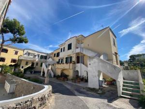 a large building with a staircase in front of it at Casa Franco in Ischia Town