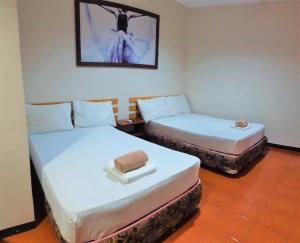 Letto o letti in una camera di Hotel California Suite