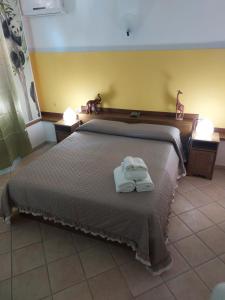 Postel nebo postele na pokoji v ubytování B&B Albachiara