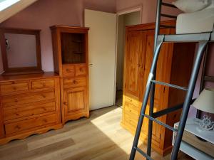a bedroom with a bunk bed and a ladder at LE TREPORT 60M2 à 2mn plage port funiculaire casino commerces in Le Tréport +5 photos