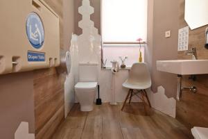 a bathroom with a toilet and a sink at HB Torrevieja in Torrevieja +252 photos