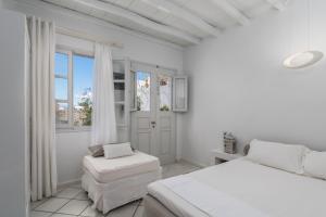 A bed or beds in a room at Archondoula Studios