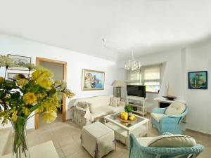 a living room with a couch and chairs at Villa Julia in Sani Beach